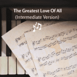 Sheet music for The Greatest Love Of All on a piano keyboard.