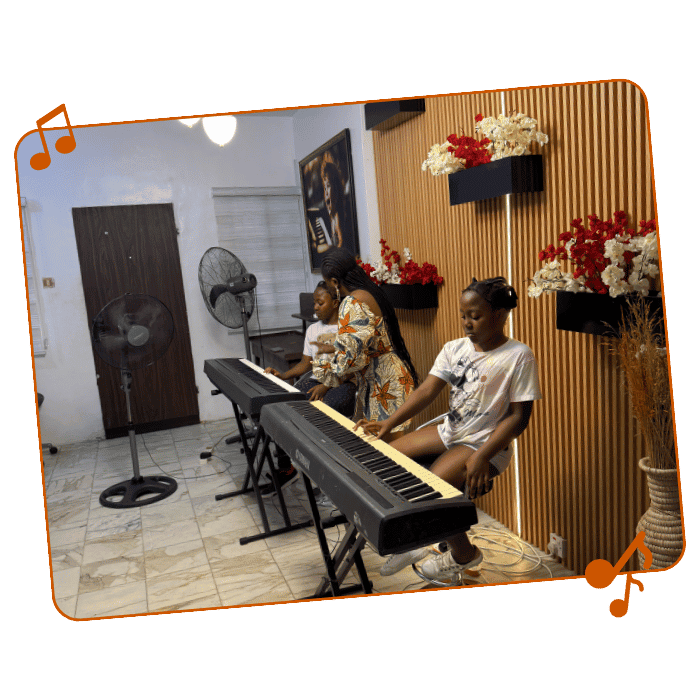 Young students playing digital pianos during summer class at Pianogoddess Academy.