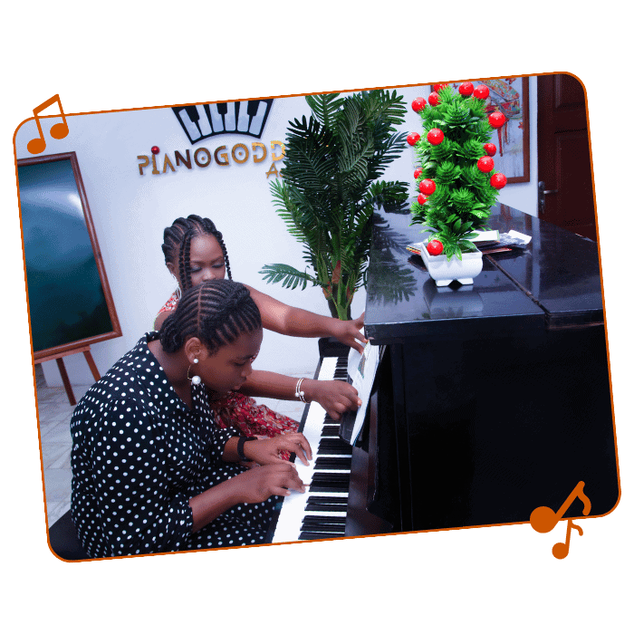 Young girls playing piano at Pianogoddess Academy summer class.